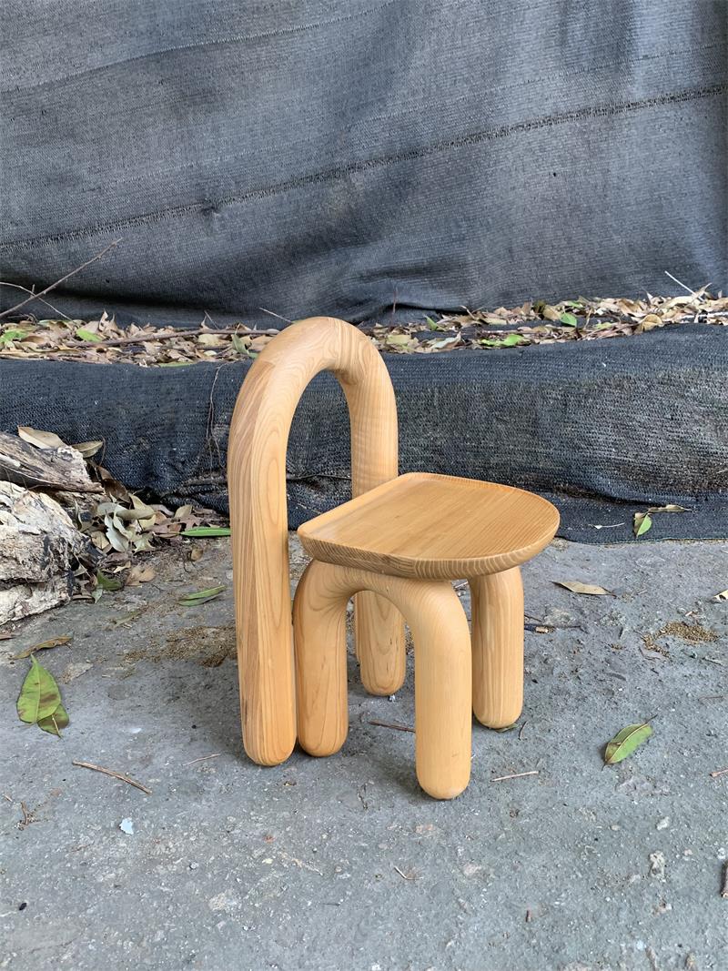 Organic modern hand-carved solid wood chubby arched small chair