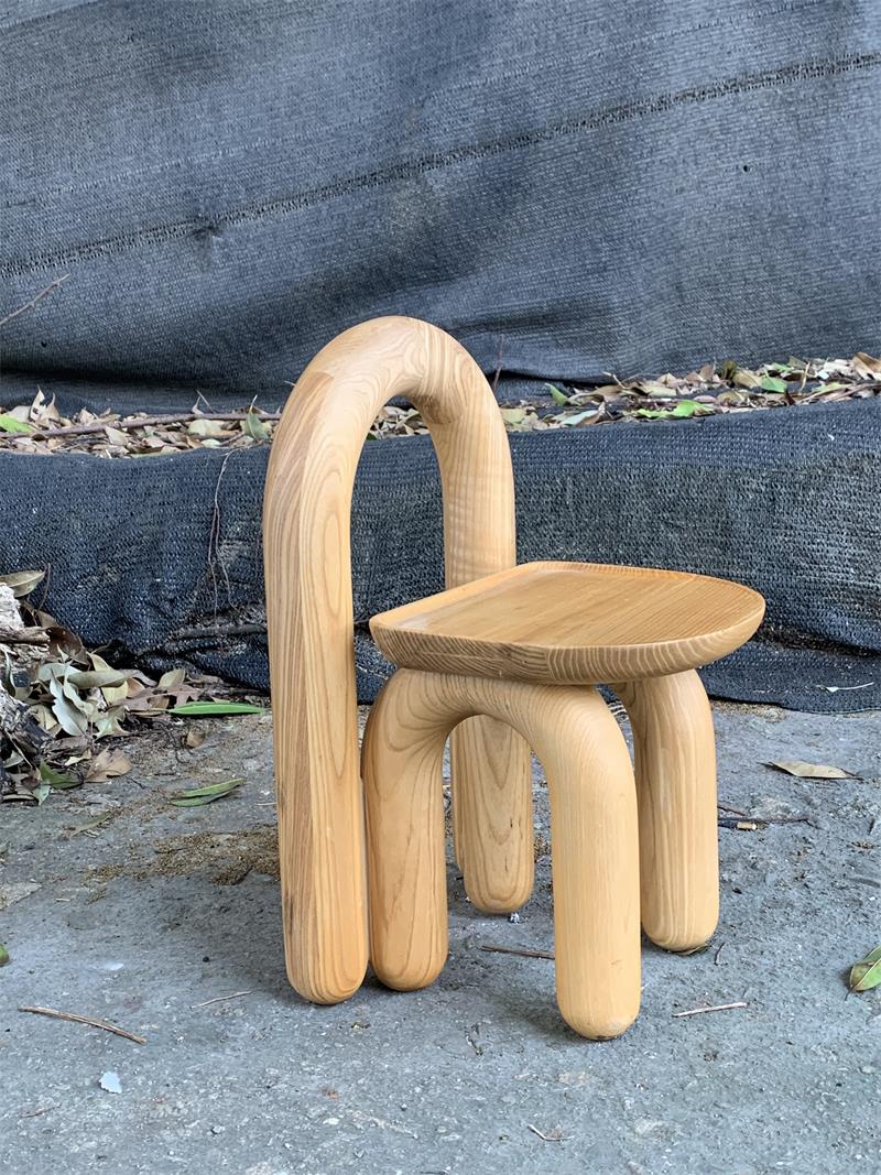 Organic modern hand-carved solid wood chubby arched small chair