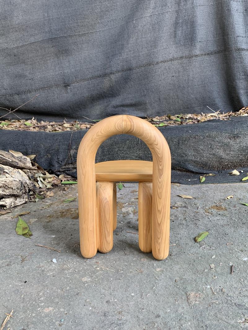Organic modern hand-carved solid wood chubby arched small chair