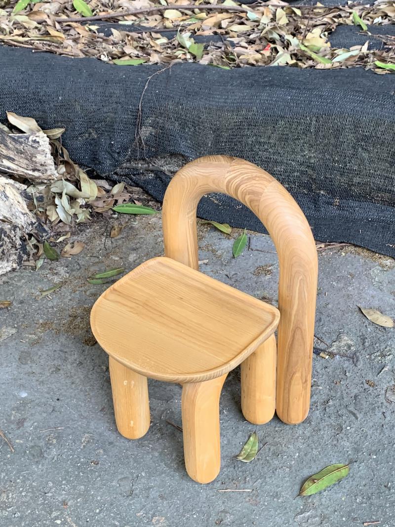 Organic modern hand-carved solid wood chubby arched small chair