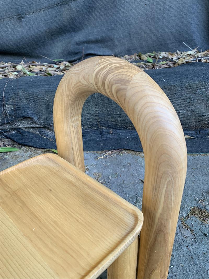 Organic modern hand-carved solid wood chubby arched small chair