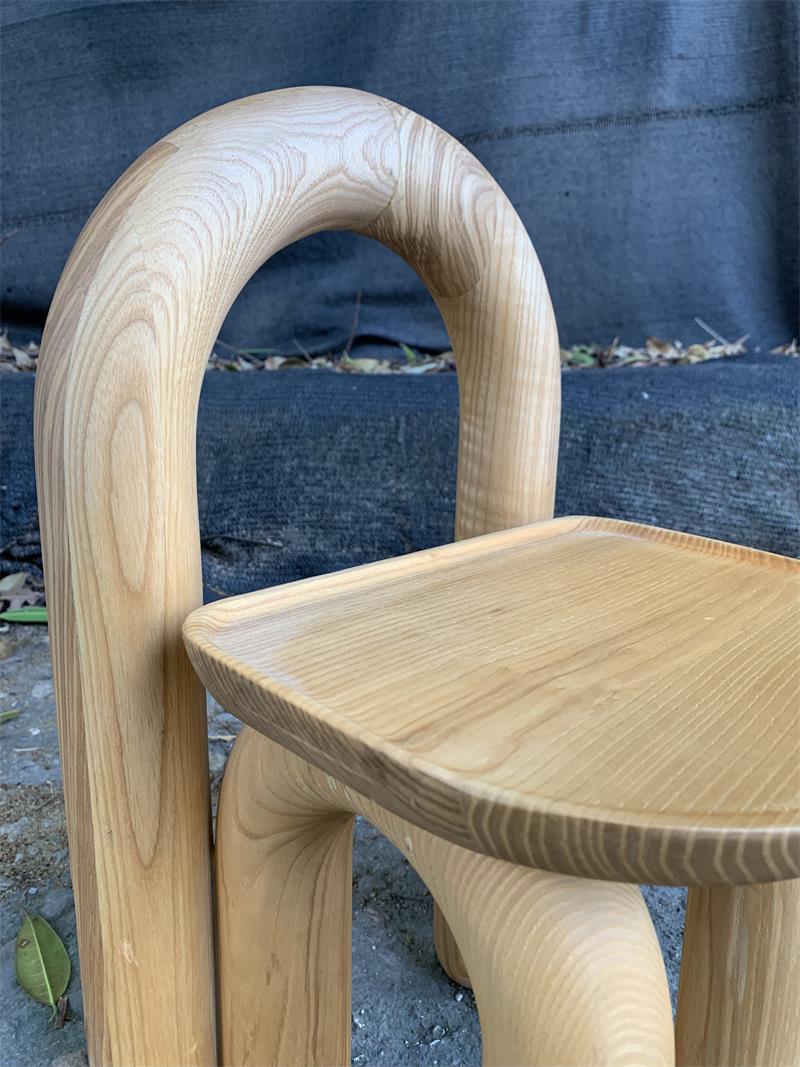 Organic modern hand-carved solid wood chubby arched small chair