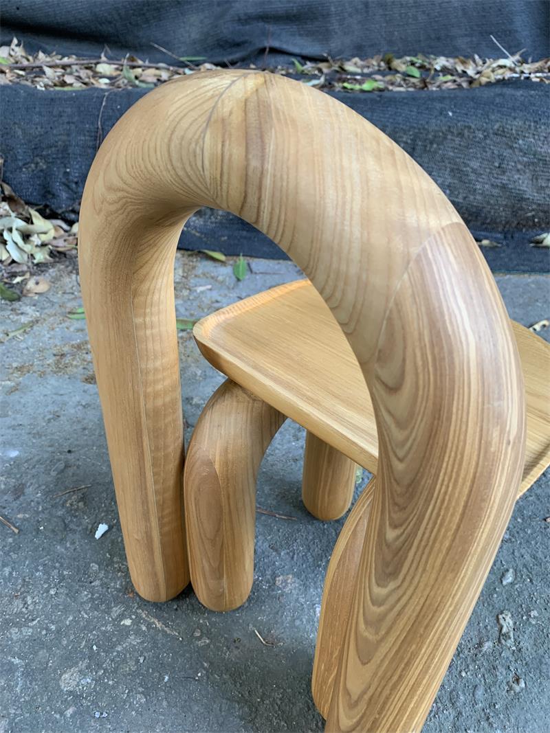 Organic modern hand-carved solid wood chubby arched small chair