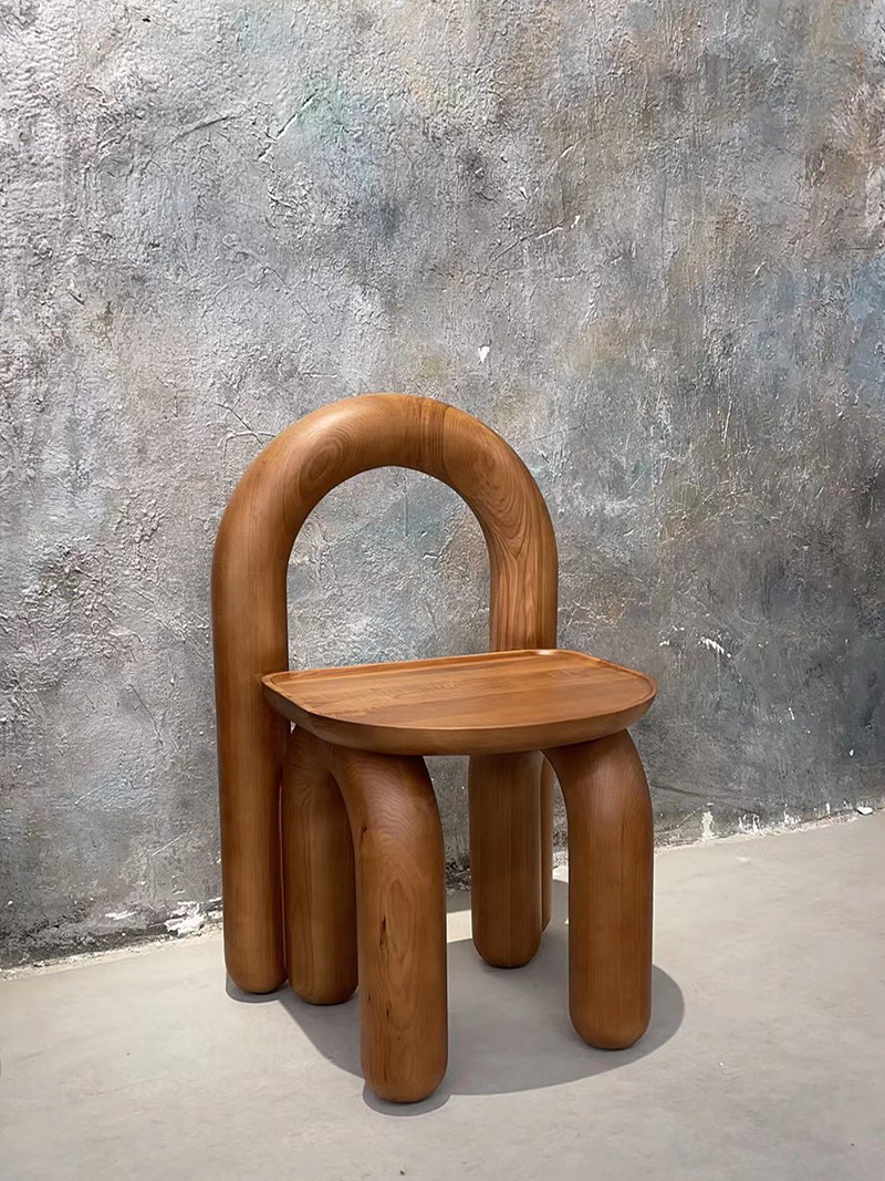 Organic modern hand-carved solid wood chubby arched small chair