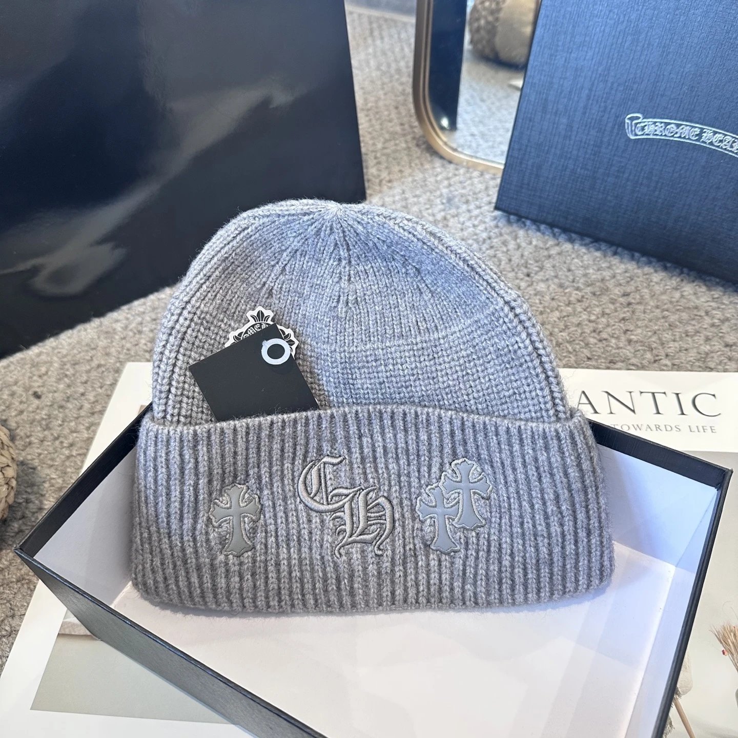 High quality cross autumn and winter knitted hat with yarn