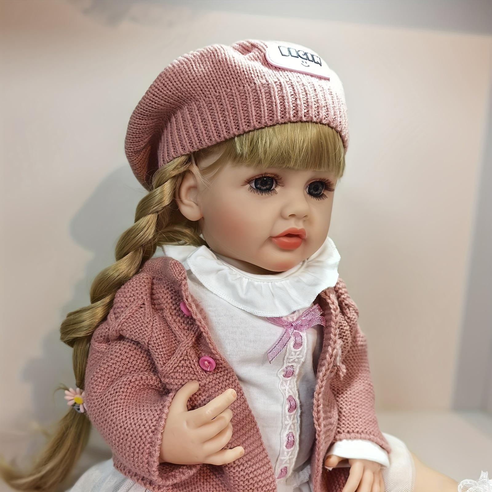 KEIUMI Reborn Baby Dolls- Birthday and Christmas Gift for Kids,22 inch Full Body Silicone Baby Girl-Betty with 2Golden Braids,BlueEyes,White Peter Pan Collar Dress,Dusty PinkCardigan,BeretHat,LaceSocks,LeatherShoes 2 Pink Daisy Hair Ties,Gift for Girls 3+