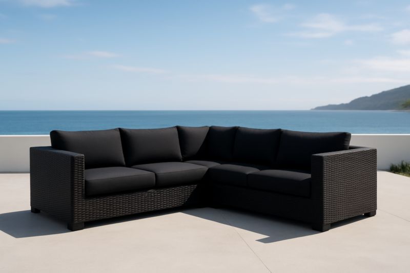 Divano ad angolo da esterno in polyrattan nero con cuscini in poliestere