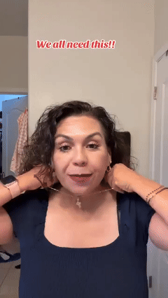Hands bringing magnetic jewelry clasp ends together