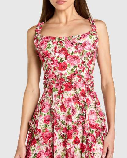 Vestido rosa de corte A con volantes y escote redondo, estampado floral.