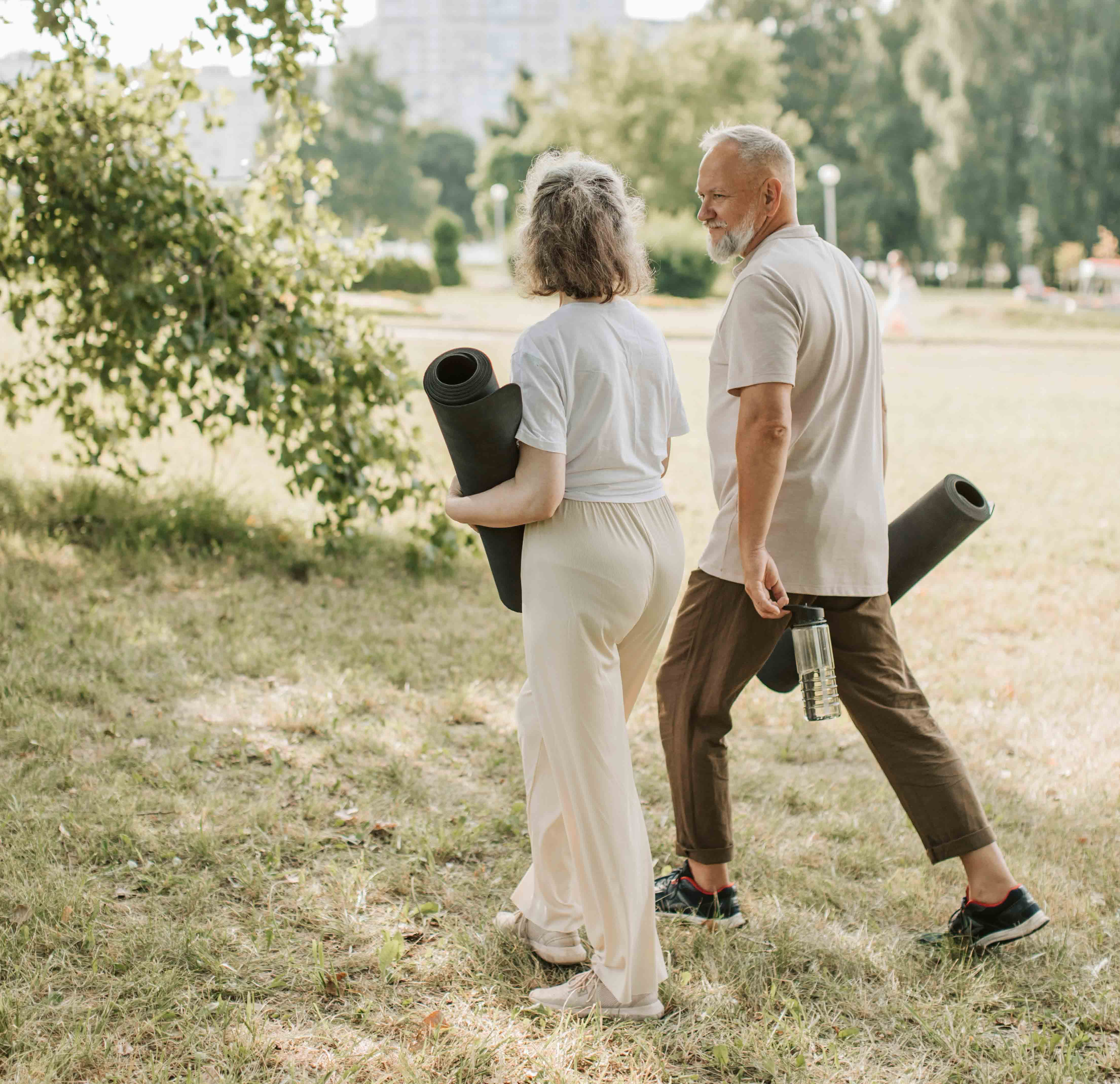 Photo by Vlada Karpovich: https://www.pexels.com/photo/an-elderly-couple-walking-together-while-carrying-rolled-yoga-mats-and-a-water-bottle-8939936/