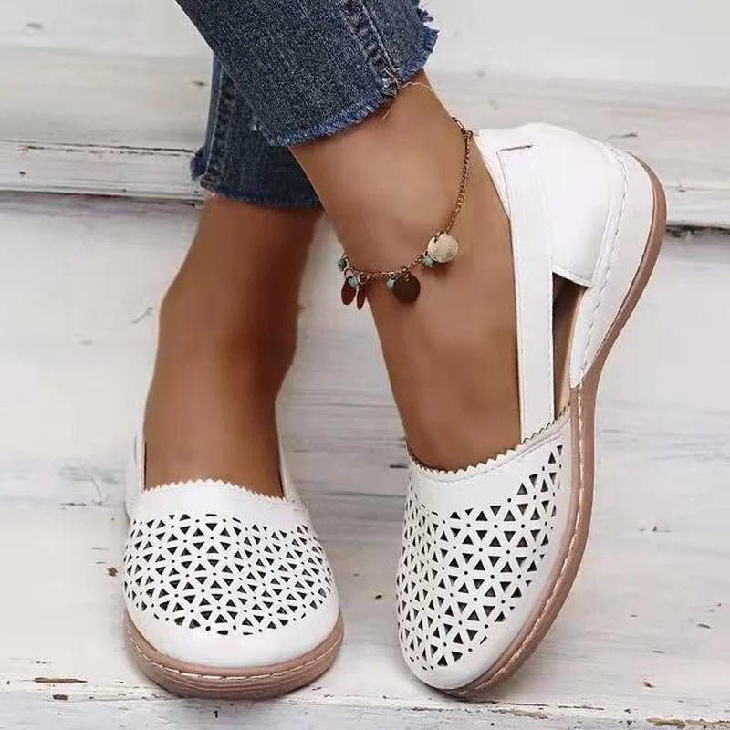 Chic Wedge Orthopedic Women's Sandal worn by a woman on white steps with blue jeans and an ankle bracelet