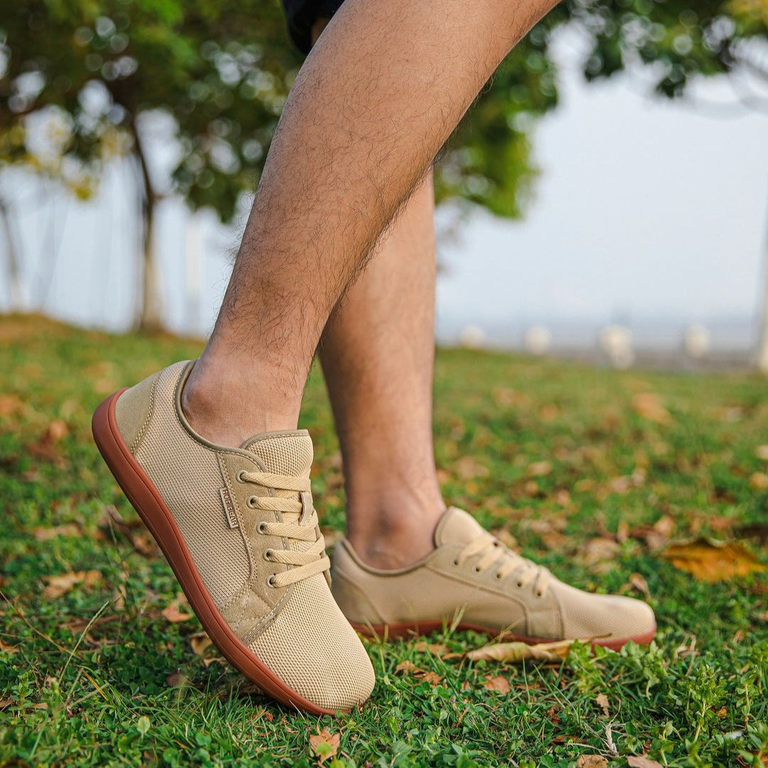 A man with tan sneakers - Joyo barefoot