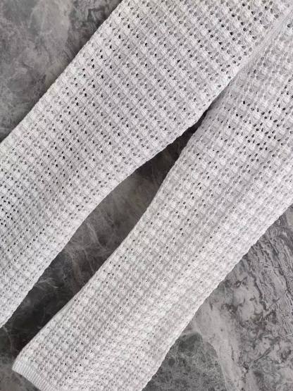 CC 26SS  Vacation style white hollow knitted pants
