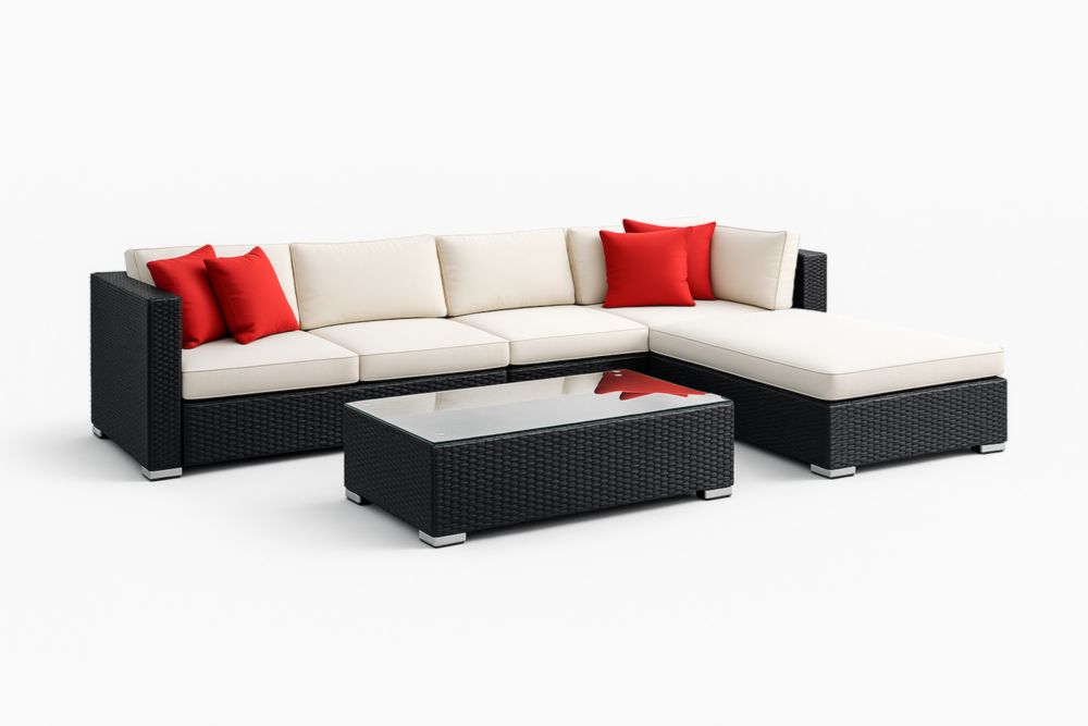 Canapé d'angle en résine tressée noir avec coussins crème et rouges pour extérieur