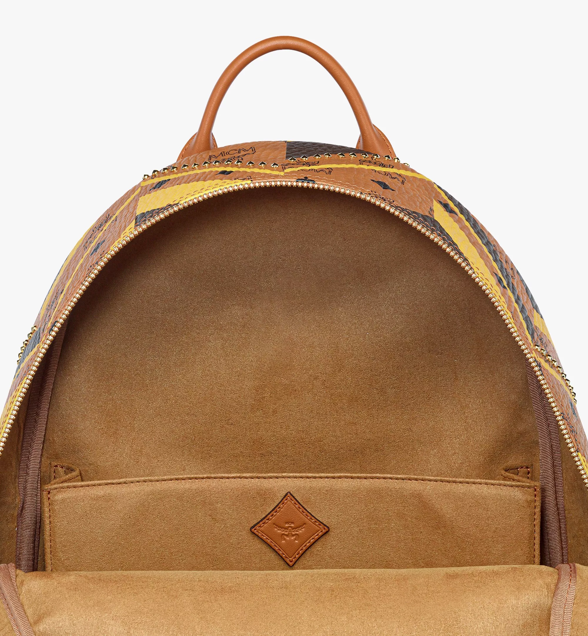 Studded Stark Backpack in Mega Herringbone Visetos（Medium）
