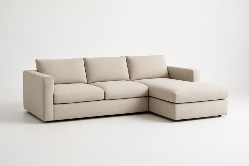 Canapé d'angle en tissu beige avec méridienne