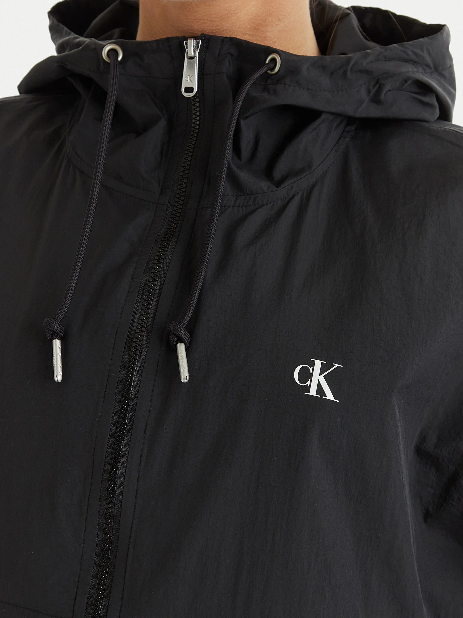Calvin Klein Sötétfekete Kapucnis Kabát – Minőség és Stílus minden napra!