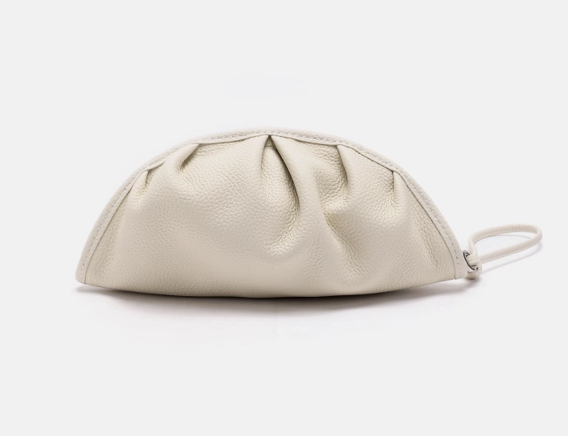 Niche relaxed style genuine leather handheld bag — a refined, portable handbag with large capacity for makeup