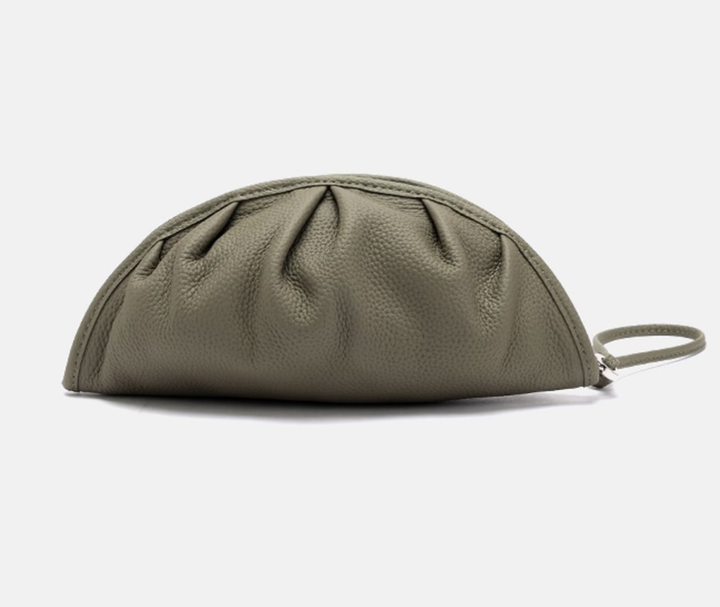 Niche relaxed style genuine leather handheld bag — a refined, portable handbag with large capacity for makeup