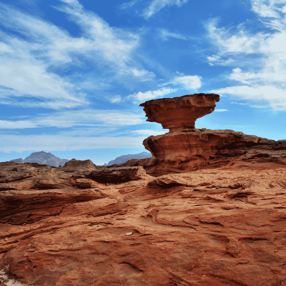 Jordan eSIM – Wadi Rum desert mushroom rock formation under blue sky, travel eSIM for Jordan
