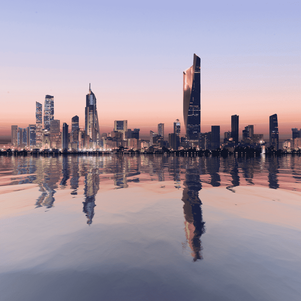 Kuwait eSIM – Kuwait City skyline reflecting on the Arabian Gulf at sunset, travel eSIM for Kuwait

