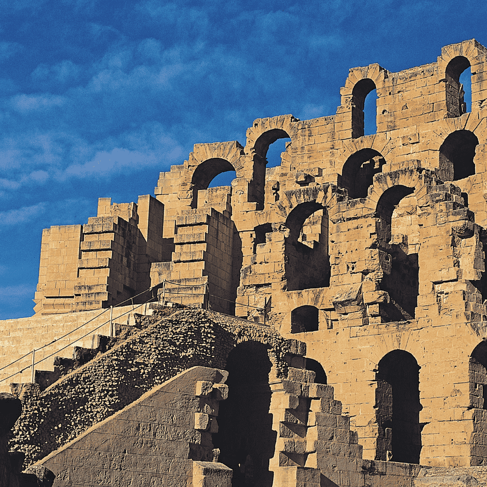 Tunisia eSIM – El Jem Roman Amphitheatre ancient ruins under blue sky, travel eSIM for Tunisia
