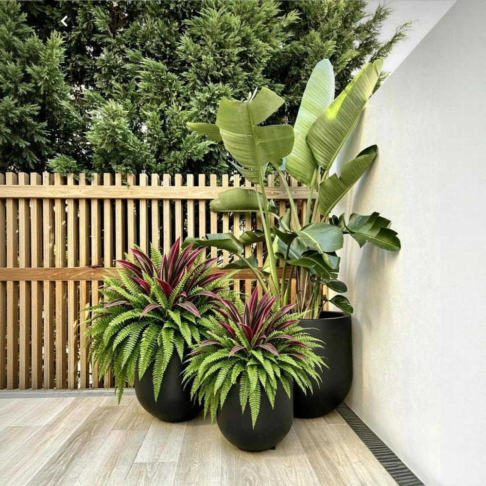 Artificial fern and red dracaena patio planter styling