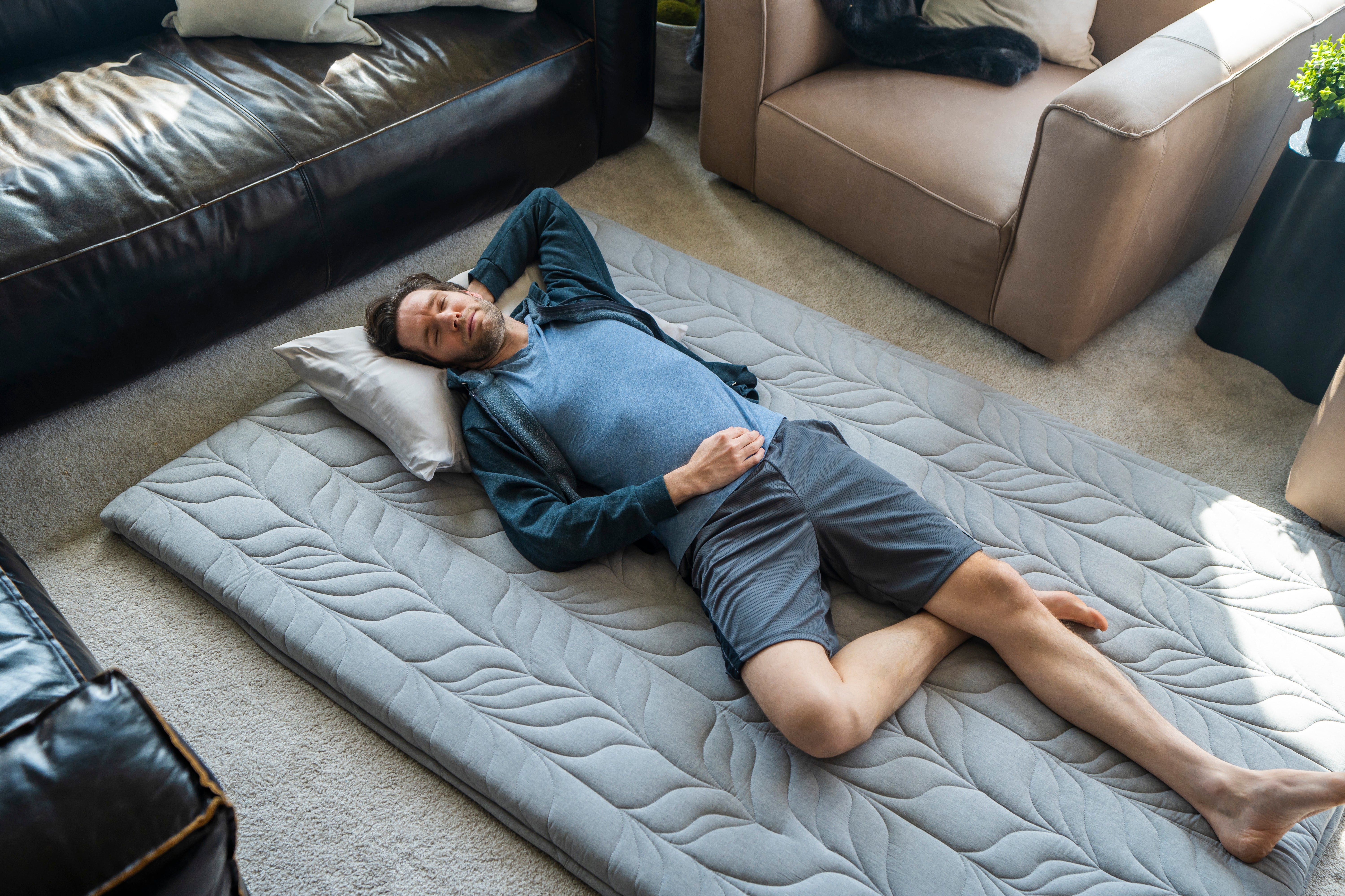 a man sleep on floor mattress