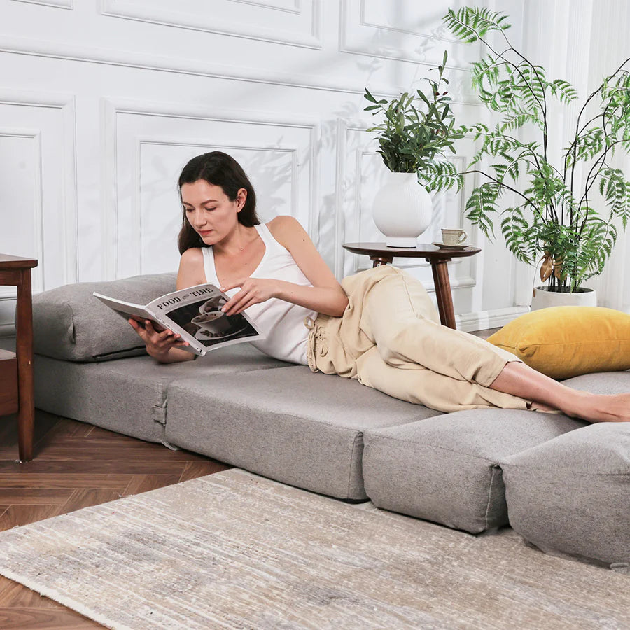 a woman sleep on futon sofa bed