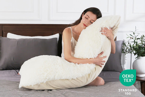 a women snuggle with a cozy body pillow