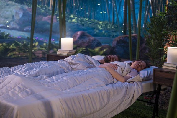 two people are sleeping with cooling blanket