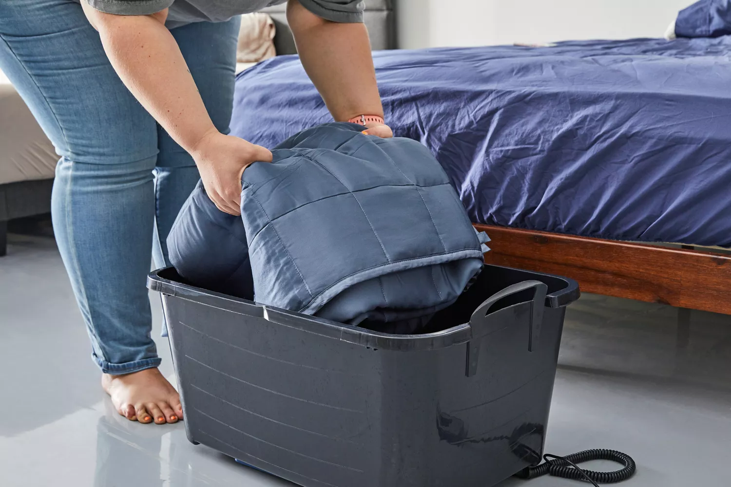 ZonLi Bamboo Cooling Weighted Blanket being put in a basket