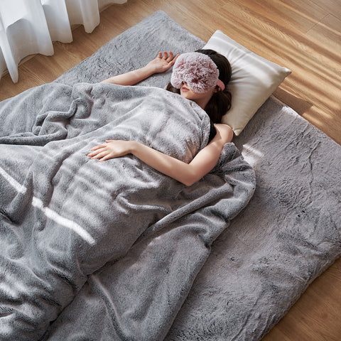 sleep under a heated weighted blanket