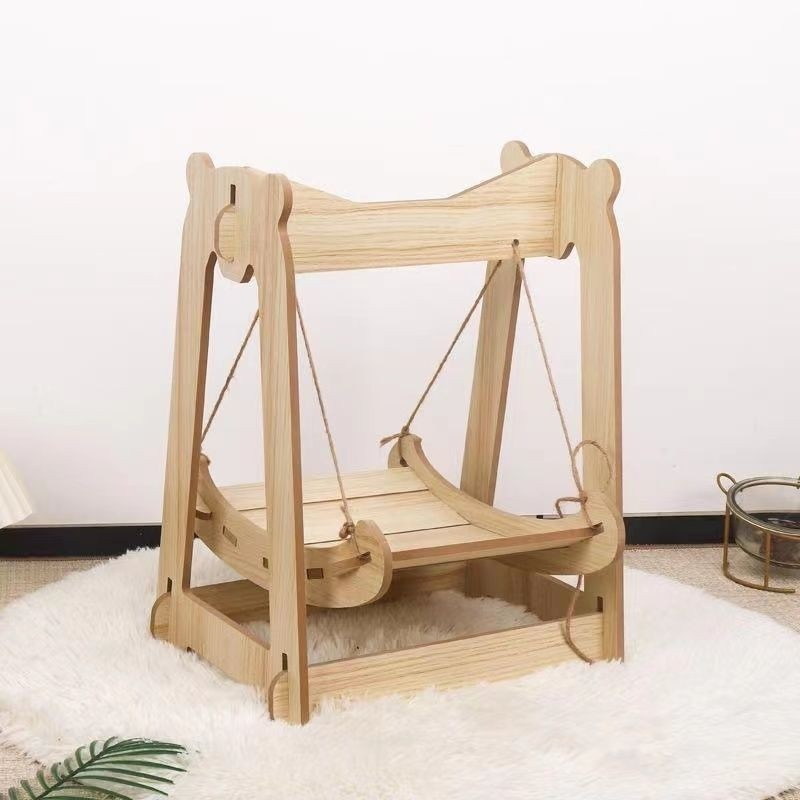 Drewniane łóżko bujane dla kotów