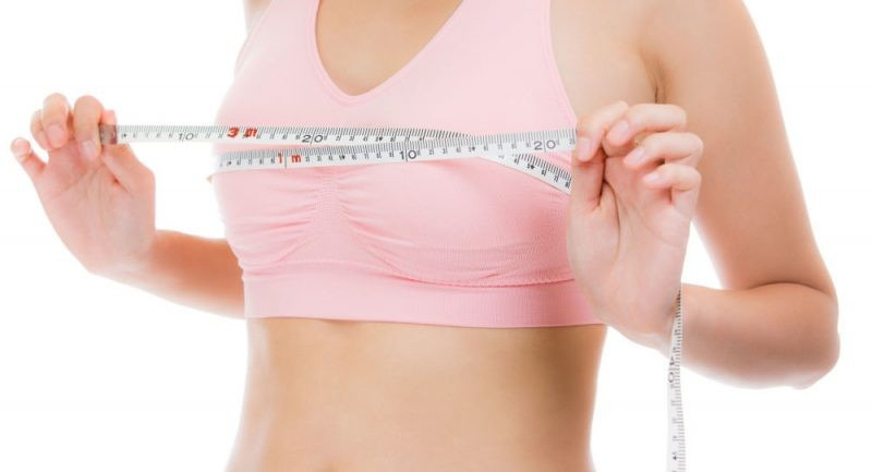 Take a measurement in inches over the fullest part of your bust, keeping the tape level around your body. Ensure that the tape isn't too tight by taking a deep breath in and out.