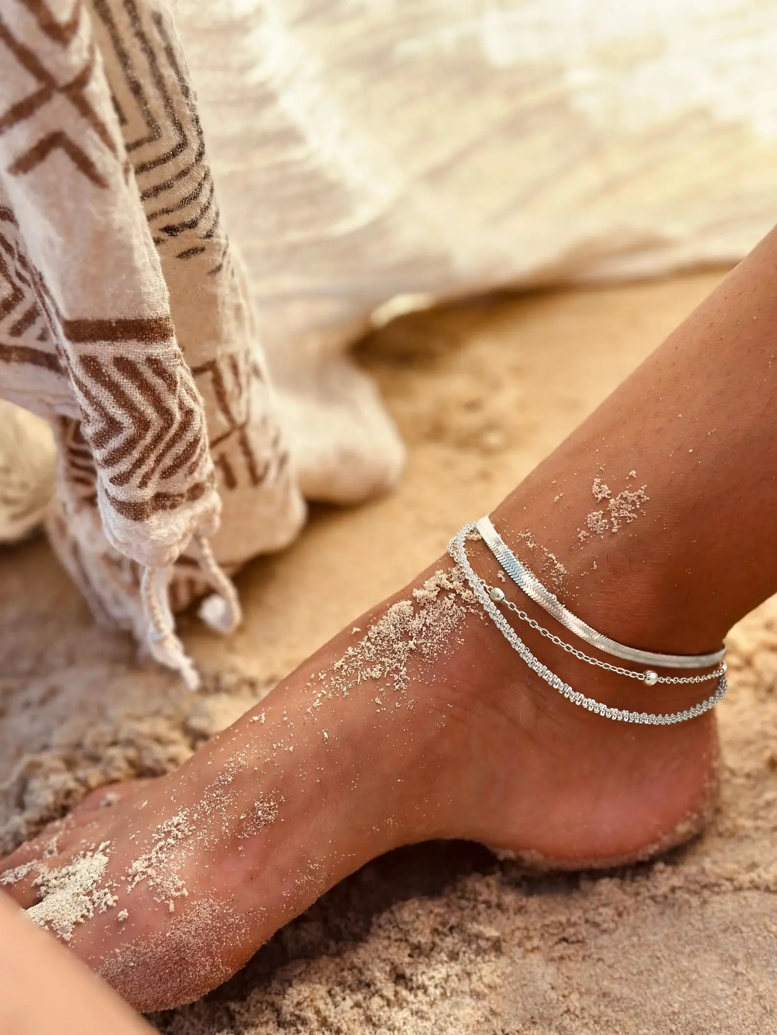 Three styles of layered anklets