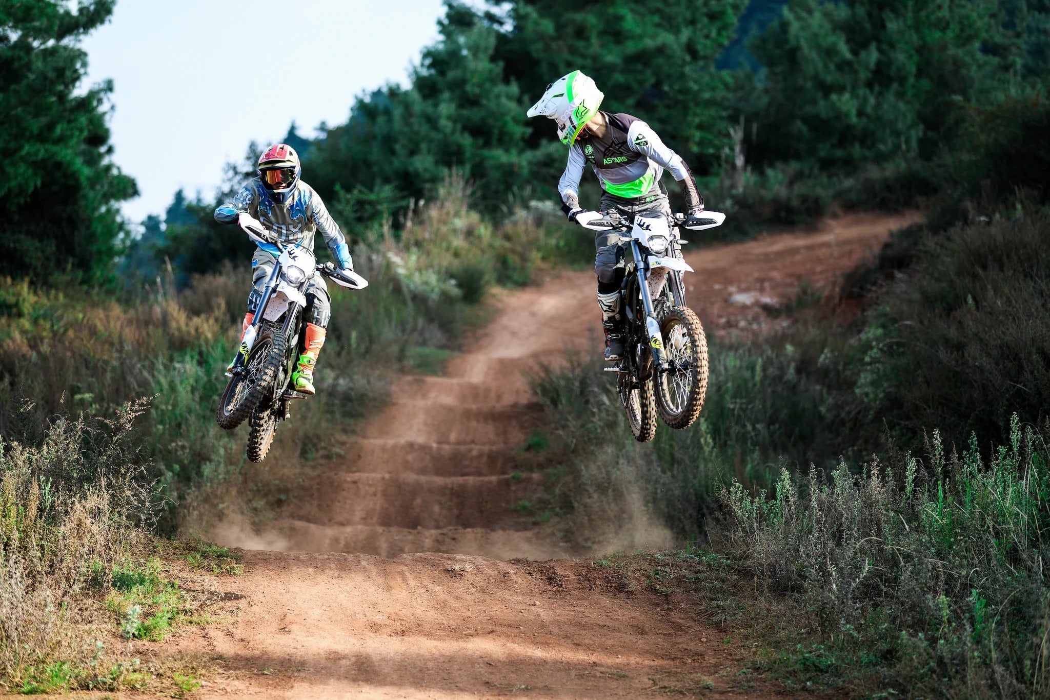 Surron Ultra Bee electric dirt bike off road jumping action trail riding high performance e-motorcycle