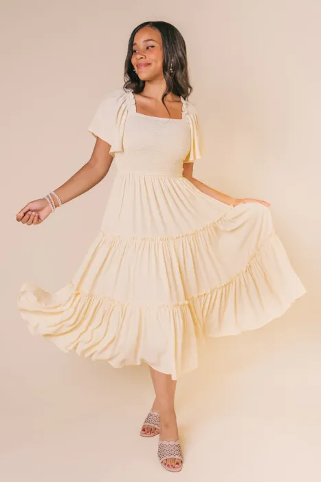 This lightweight, flowy, butter-colored dress is an effortless addition to any closet. 