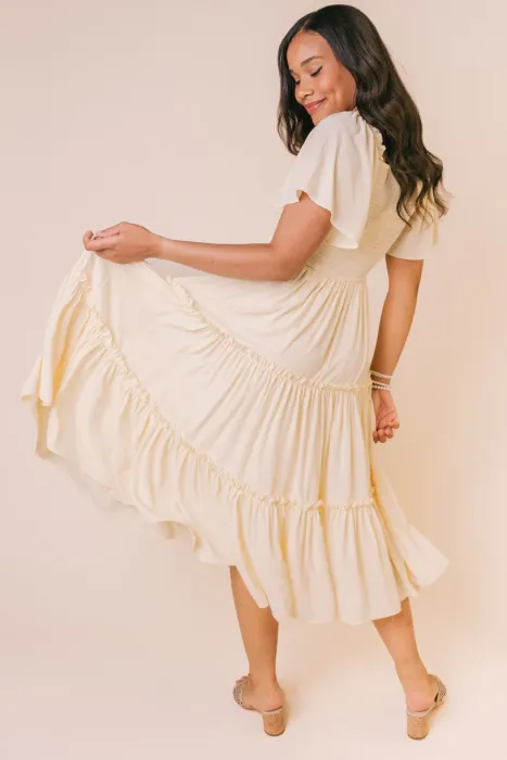 This lightweight, flowy, butter-colored dress is an effortless addition to any closet. 