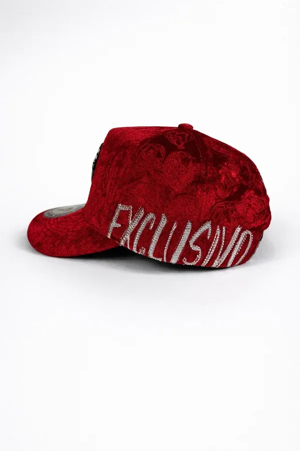 Side and back view of Ei Boo red velvet baseball cap showing adjustable strap and luxury embossed texture