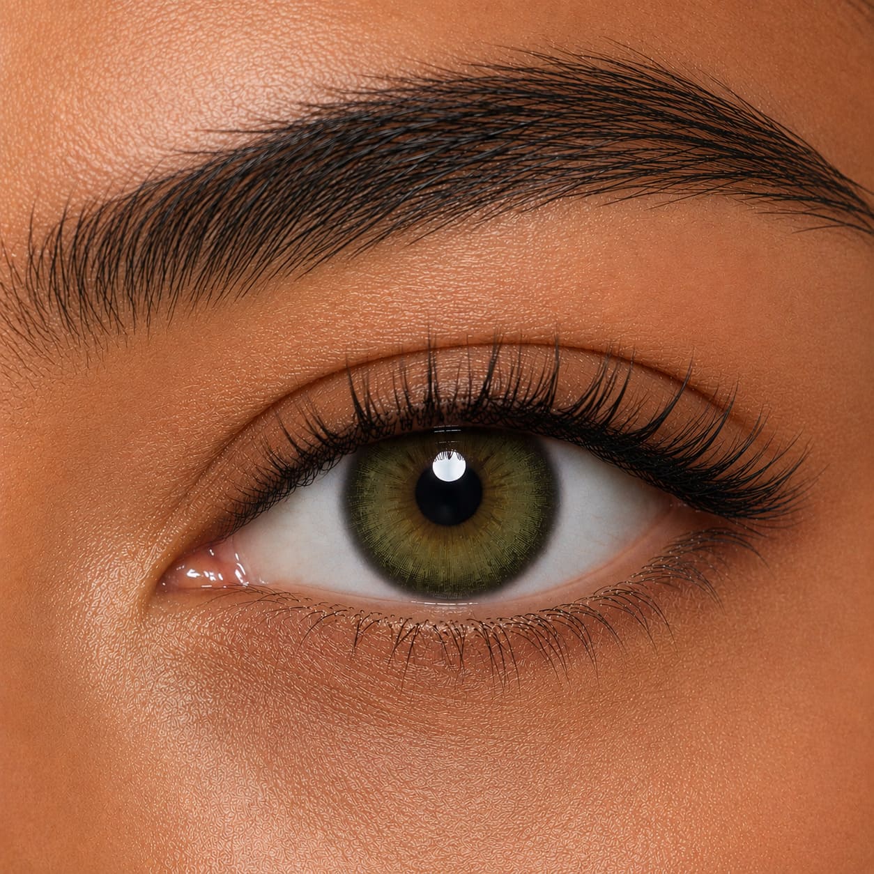 Dark brown eyes wearing Olive Green colored contacts