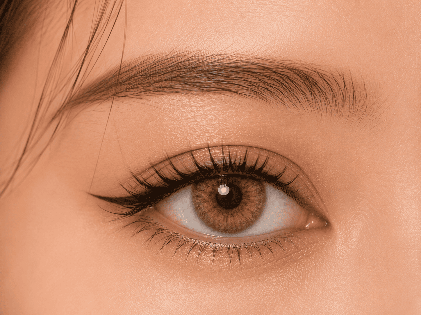 Dark brown eye wearing GODESTAR Butterscotch Ray honey amber colored contacts