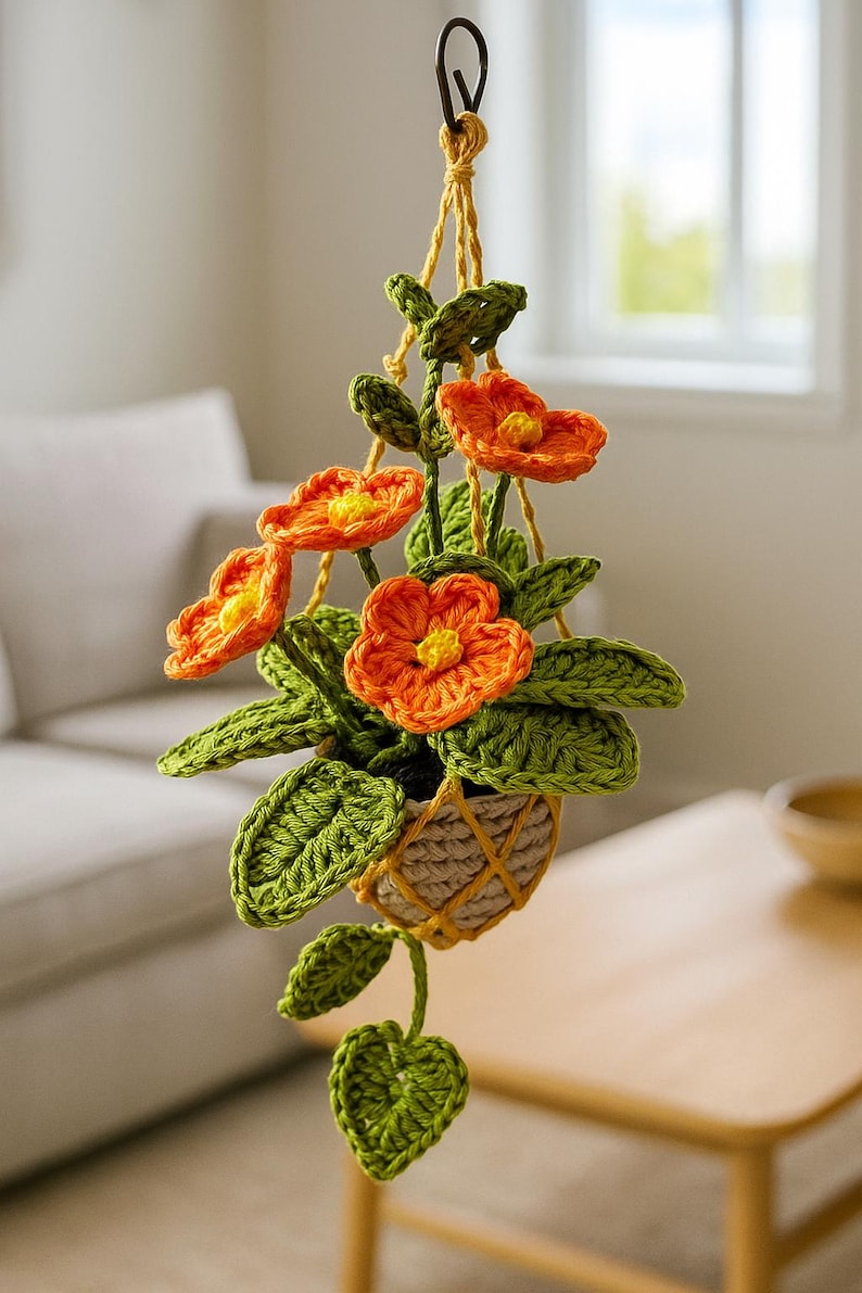 Fleurs au crochet orange amigurumi dans un pot en macramé, plante de fil suspendue faite main, décoration murale florale bohème pour les maisons confortables