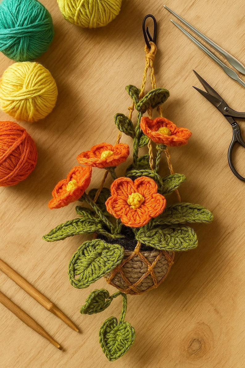 Fleurs au crochet orange amigurumi dans un pot en macramé, plante de fil suspendue faite main, décoration murale florale bohème pour les maisons confortables