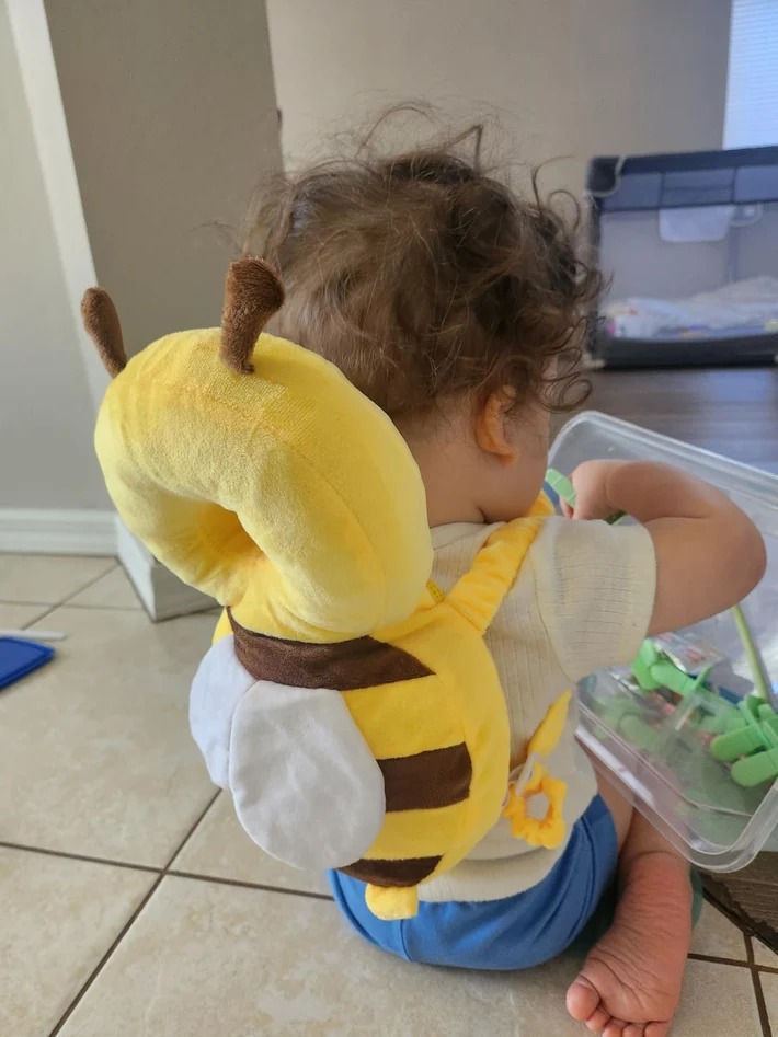 Customer photo of baby wearing the little bee head protector