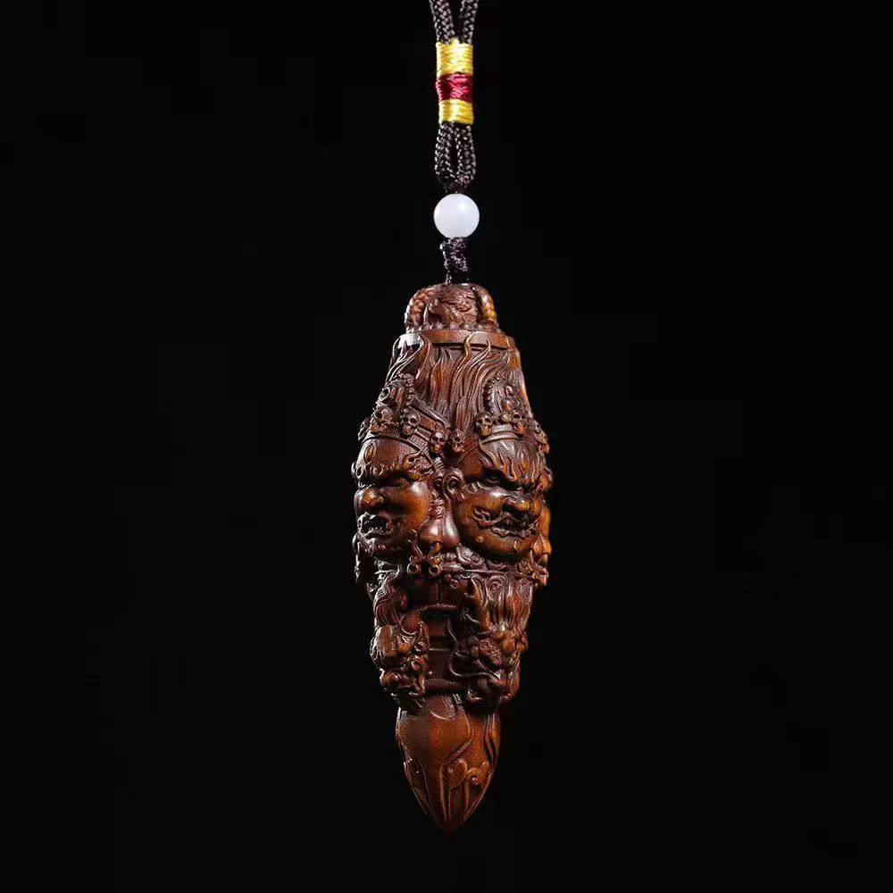 Three-Faced Mahakala Vajra Wood Pendant