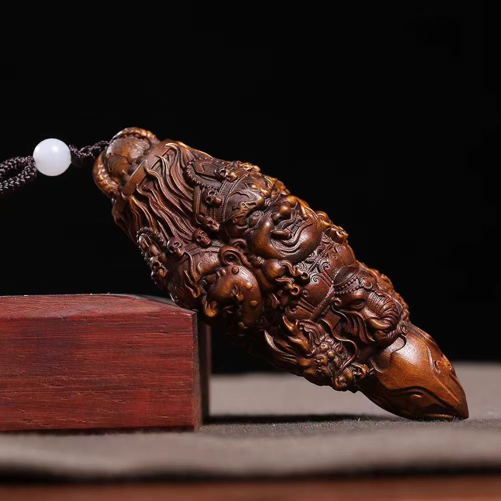 Three-Faced Mahakala Vajra Wood Pendant
