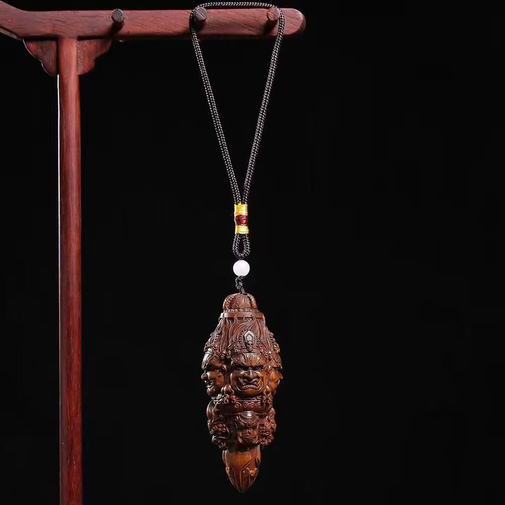 Three-Faced Mahakala Vajra Wood Pendant