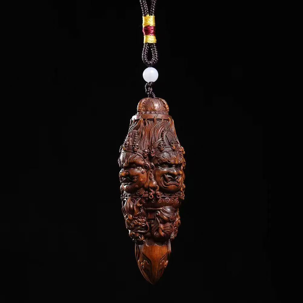 Three-Faced Mahakala Vajra Wood Pendant