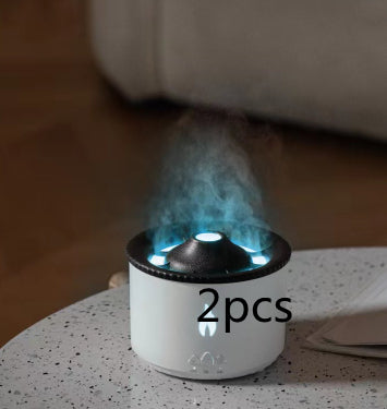 White and black humidifier emitting steam on a speckled surface with '2pcs' text.